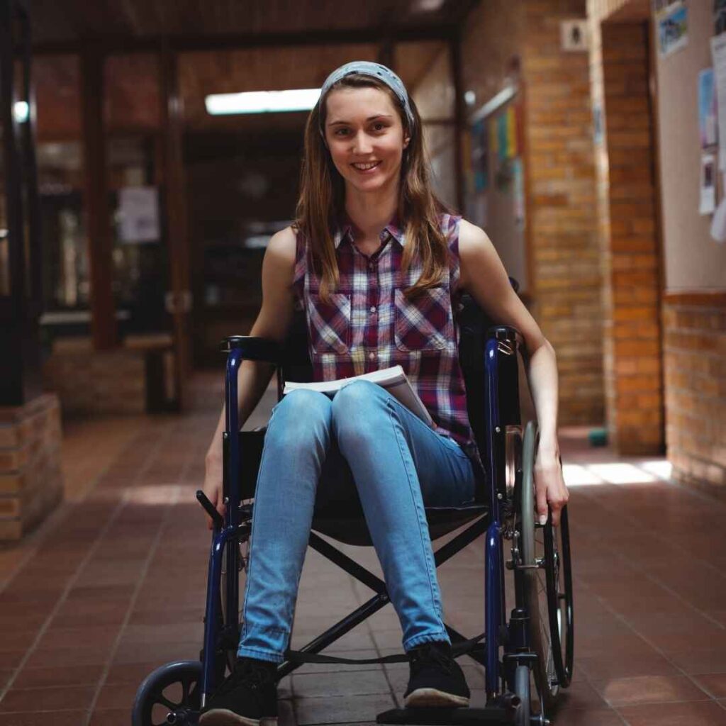 School Girl in a wheel chair smiling